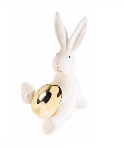 Coniglietto seduto con uovo dorato